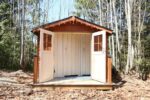 Stained exterior of compact shed house