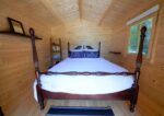 Garden shed with French doors and sweeping roof overhang