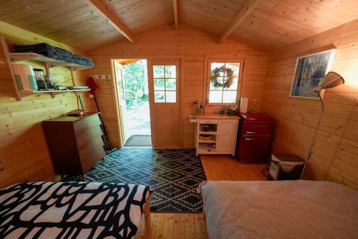 Finished garden shed interior with couch and office space