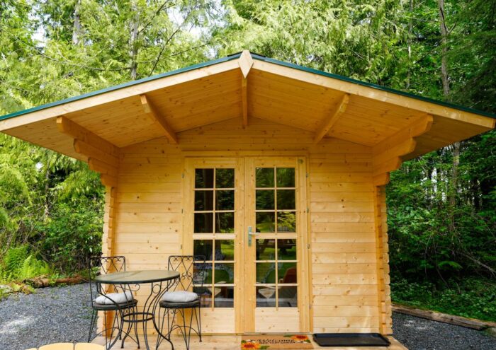 Floating wood base option for garden shed installation