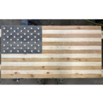 Cedar Sense natural wood sauna flag hanging inside a sauna hot room