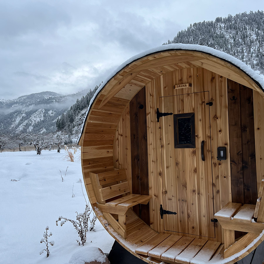 Cedar Sense barrel sauna in the snow at Kate's Montana rental home