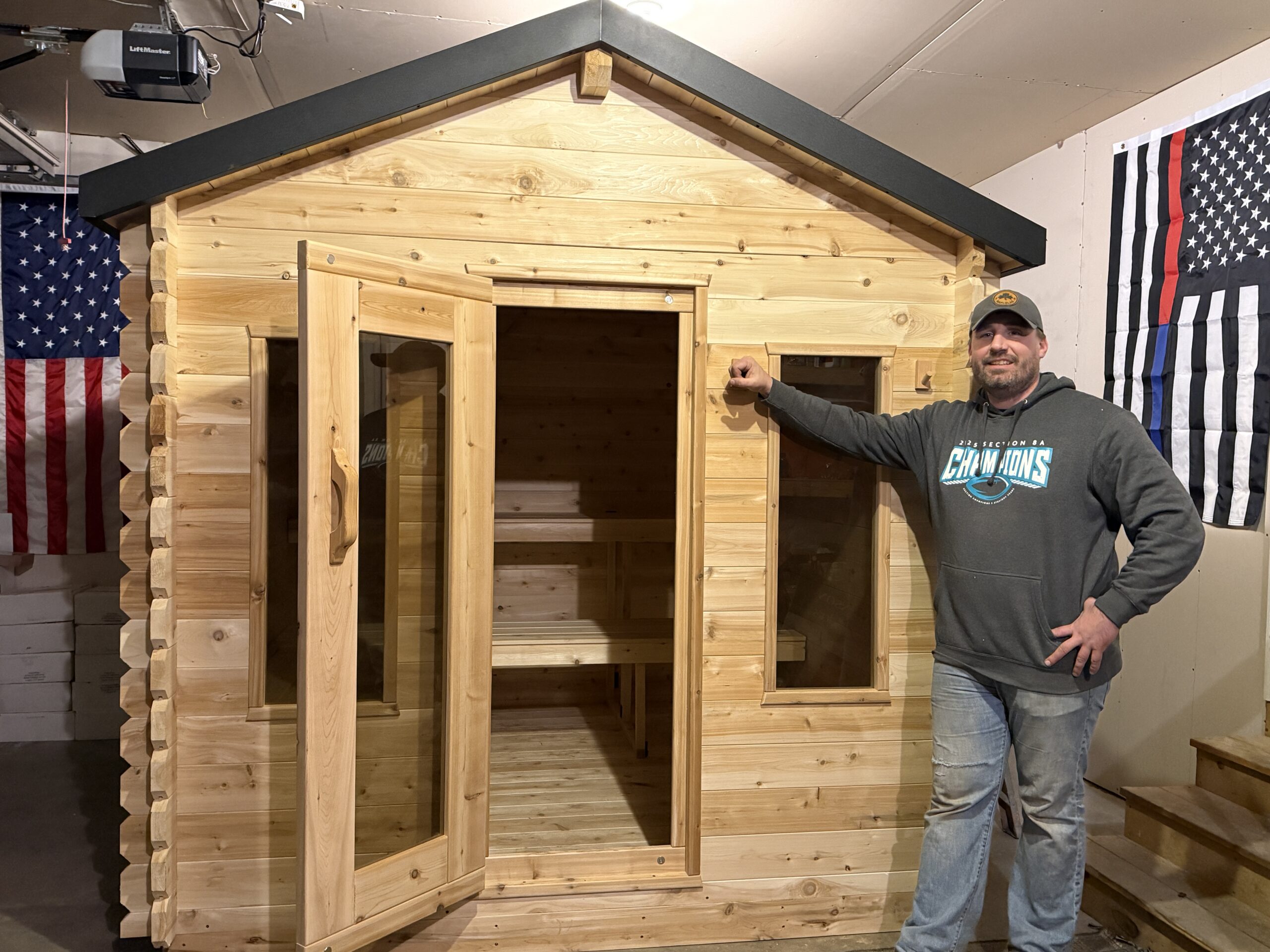Mike from Cedar Sense standing in front of a cabin sauna project
