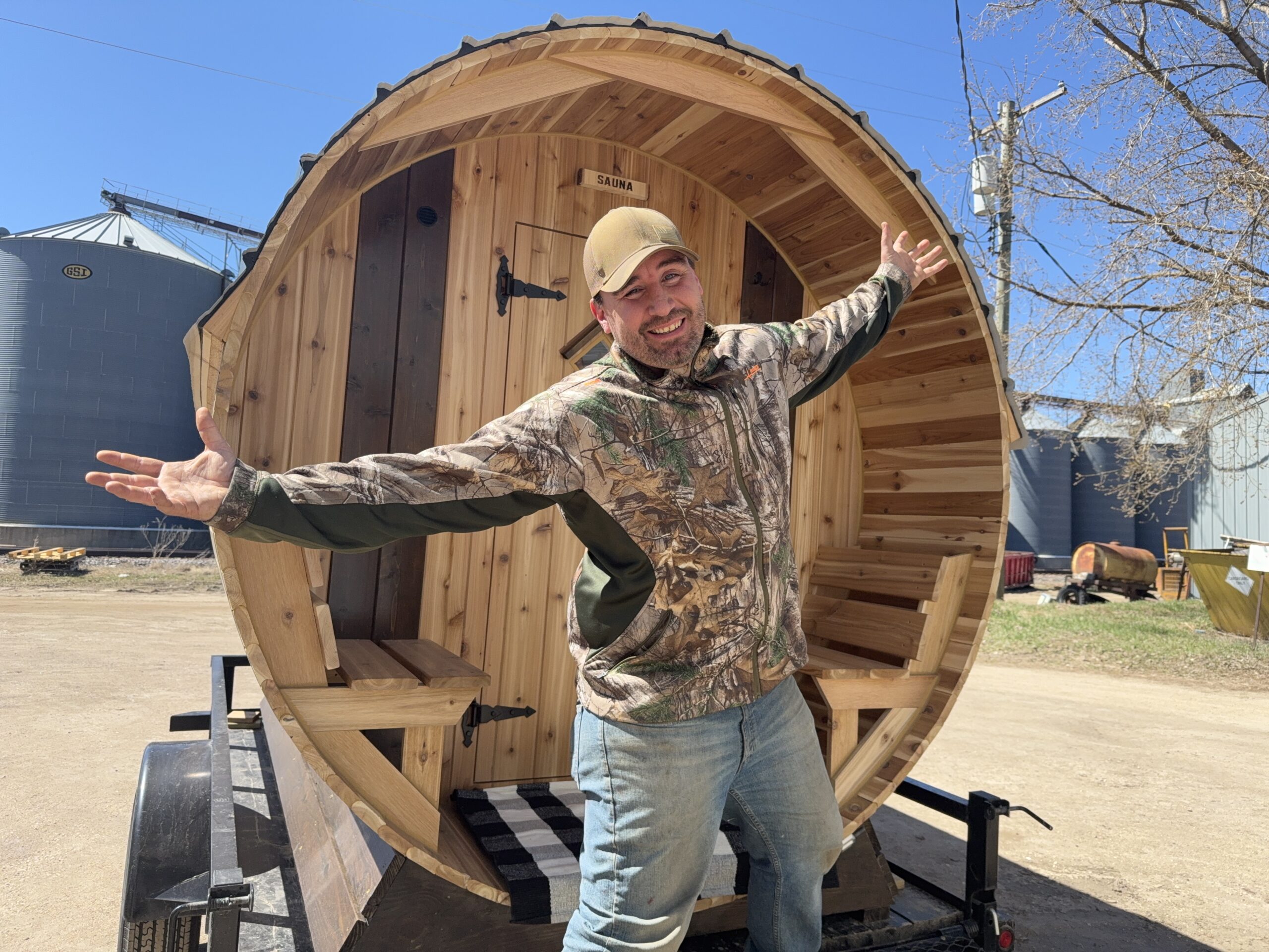 Mike from Cedar Sense standing in front of a completed barrel sauna project