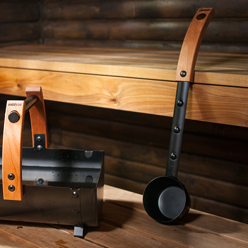 Harvia Legend sauna ladle beside matching bucket