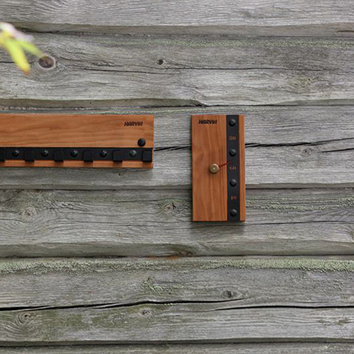 Harvia Legend sauna thermometer mounted on a wood wall